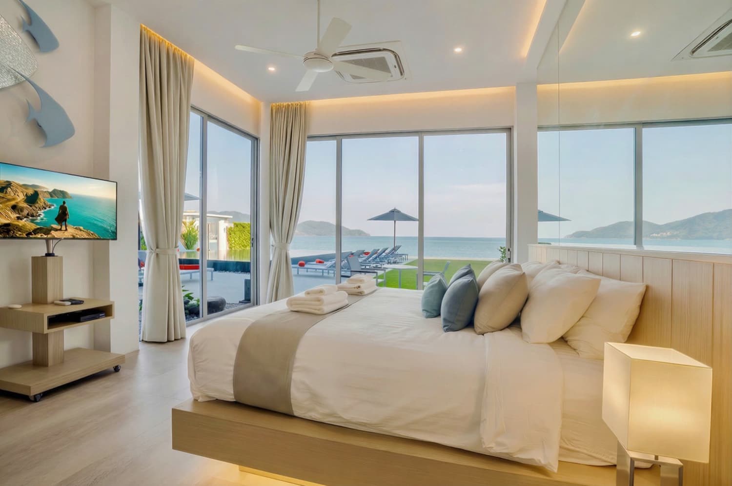 Sea-view bedroom opening onto the pool terrace