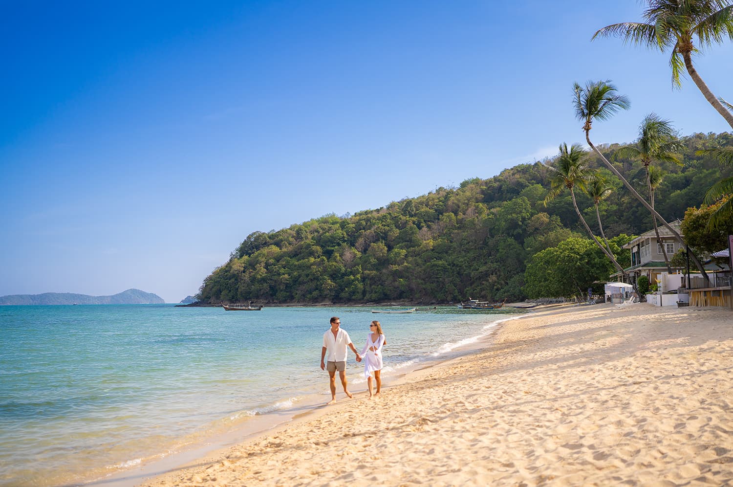 Couple walking along Ao Yon Beach
