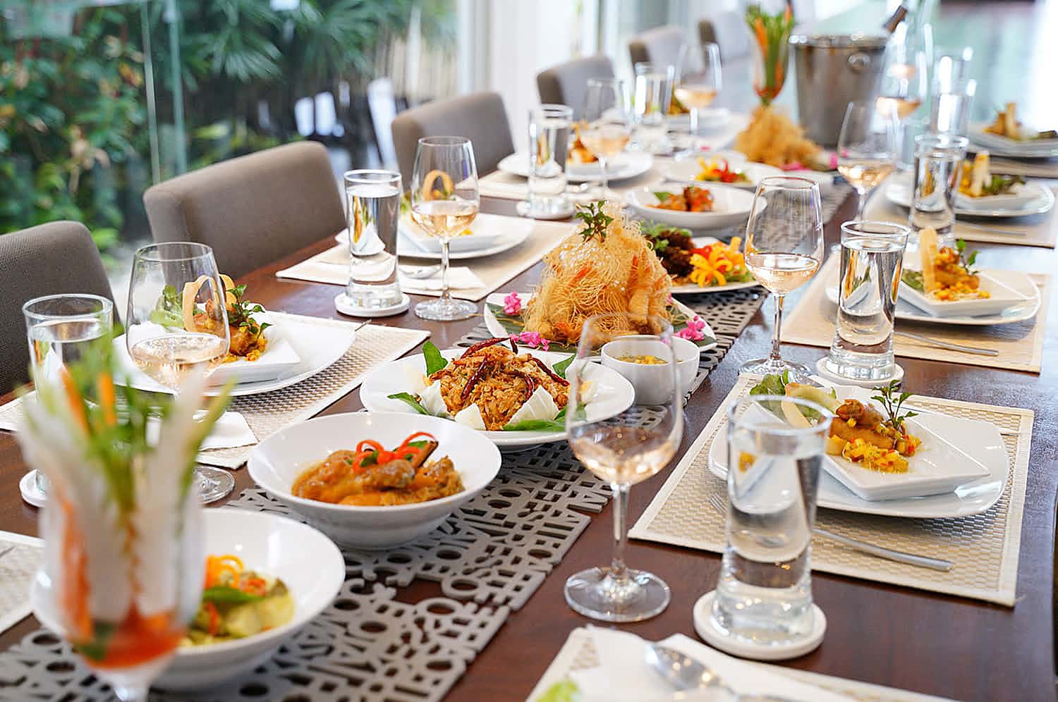 Thai banquet served on the villa's dining table